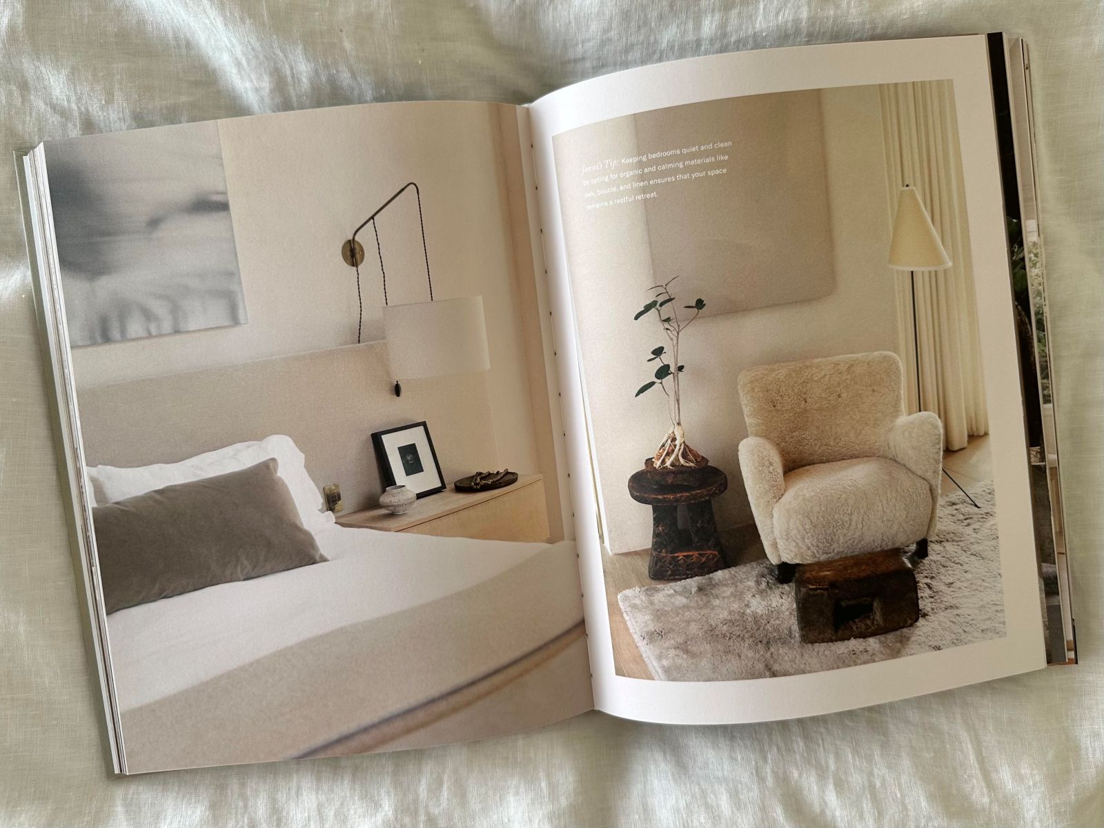 A master bedroom from Pacific Natural at Home by Jenni Kayne, featuring contemporary furniture in a muted palette, paired with a small sitting area using organic materials like oak, boucle, and linen for a refined, calming atmosphere.