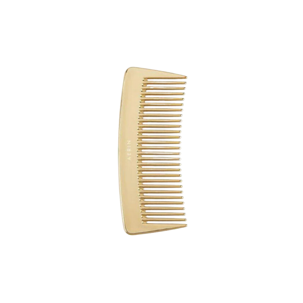 Aerin's Gold Comb, handcrafted in Italy, features polished gold tones and a wide-toothed design, adding a touch of luxury to any vanity.
