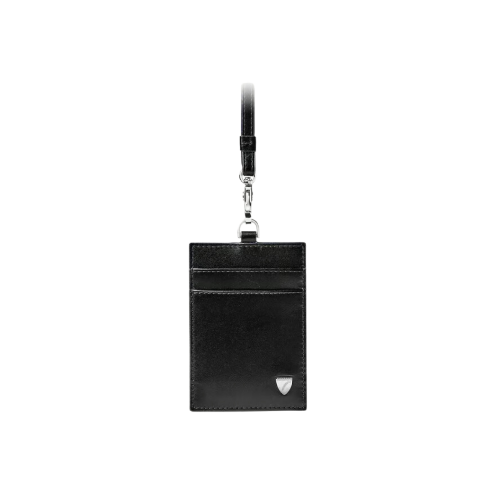 Aspinal of London's Lanyard Card Holder in smooth black full-grain leather, featuring two front card slots, an ID window on the reverse, and a detachable strap for versatile wear, combining functionality with timeless elegance.