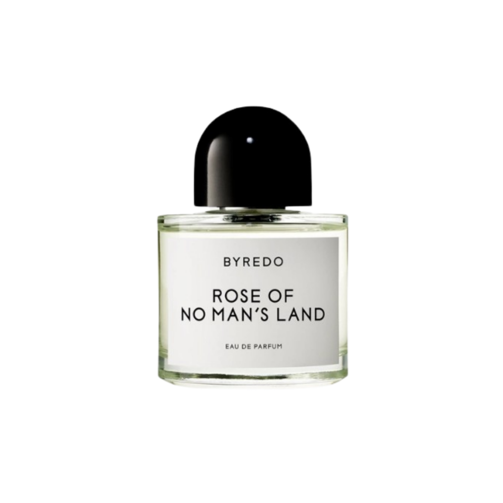 A 100ml bottle of BYREDO's Rose of No Man's Land Eau de Parfum, featuring a minimalist design with a white label and black cap. This unisex fragrance opens with top notes of pink pepper and Turkish rose petals, unfolding into a heart of raspberry blossom and Turkish rose absolute, and settles into a base of papyrus and white amber. The scent is a tribute to the selflessness and compassion of nurses during WWI.