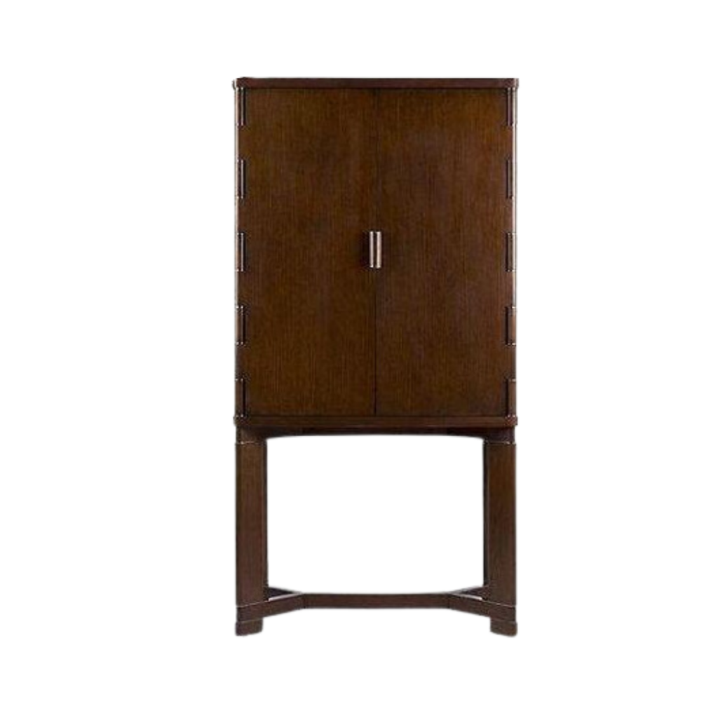 Ralph Lauren's Barnes Mixology Cabinet, crafted from quarter-sawn oak, features a sleek frame with polished stainless steel trim, offering an elegant storage solution for your home bar essentials.