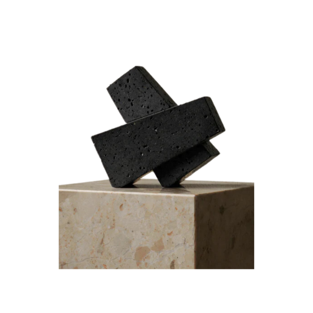 Audo CPH Converge Bookends crafted from textured lava stone, featuring abstract forms that function as both book supports and sculptural accents.