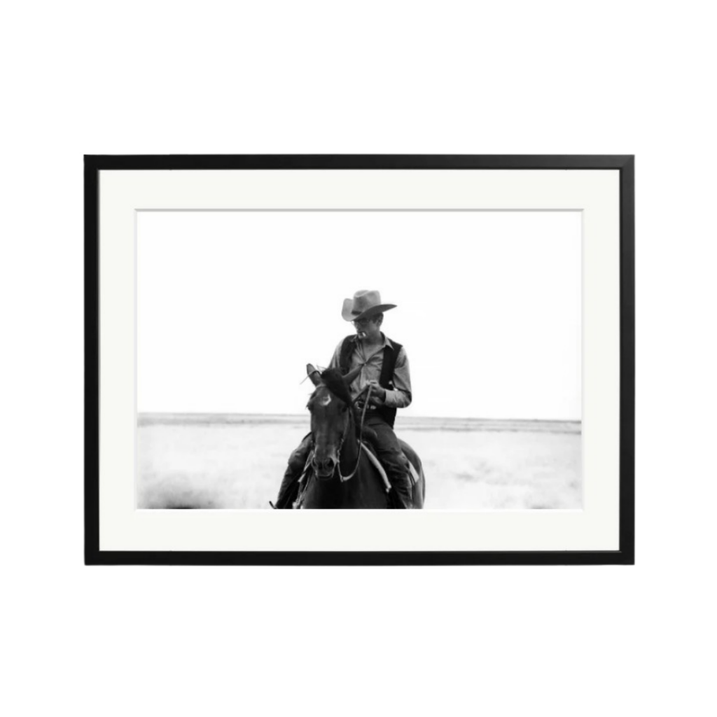 Limited-edition Sonic Editions print of James Dean on horseback in Western attire from the 1955 film Giant, captured by Allan Grant, framed in gallery-quality black wood