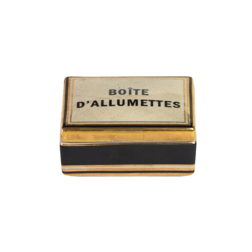 Plain & Simple Australia's Tinture Allumettes is a ceramic match holder featuring a sleek black and gold design, elegantly storing extra-long matches for lighting candles or fires.