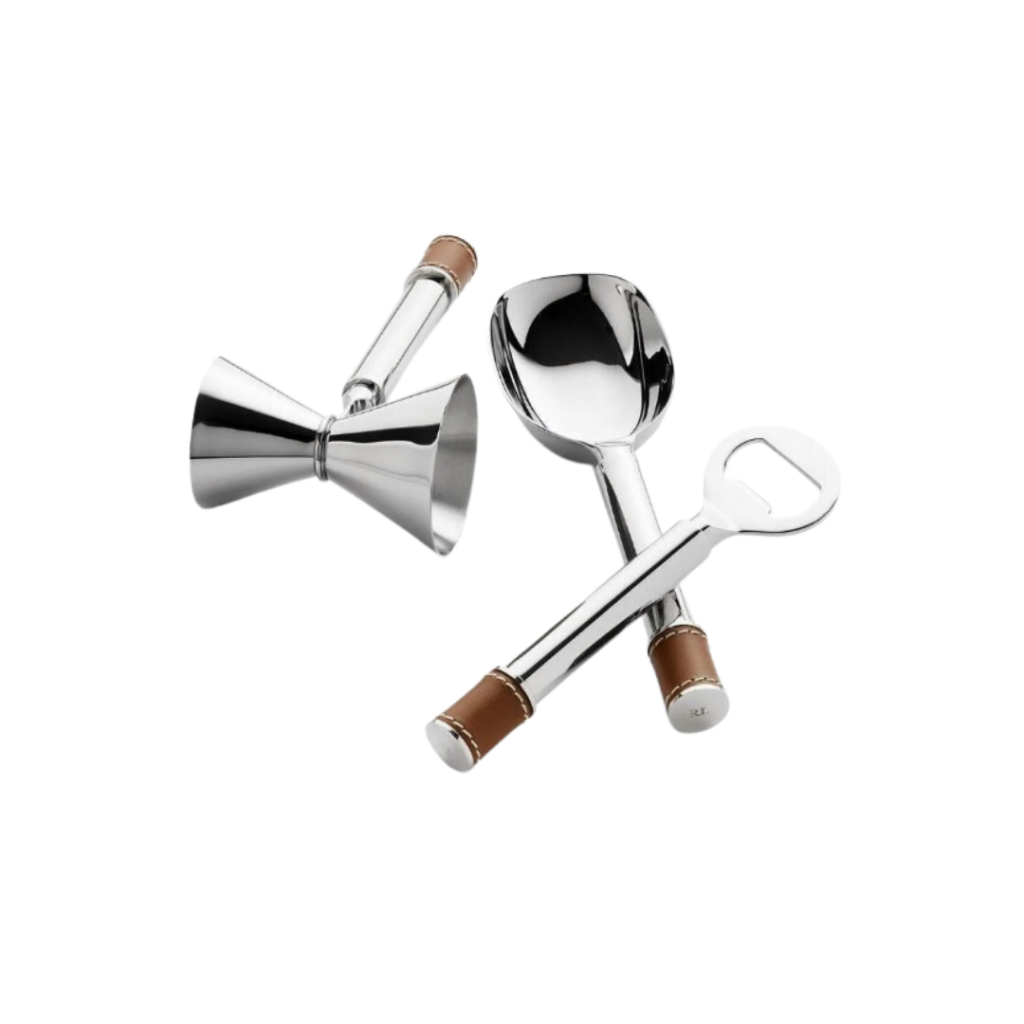 Ralph Lauren Wyatt Bar Tools Set of 3 featuring a stainless steel scoop, jigger, and bottle opener, each accented with saddle leather handles and engraved "RL" rivets, combining functionality with refined equestrian design.