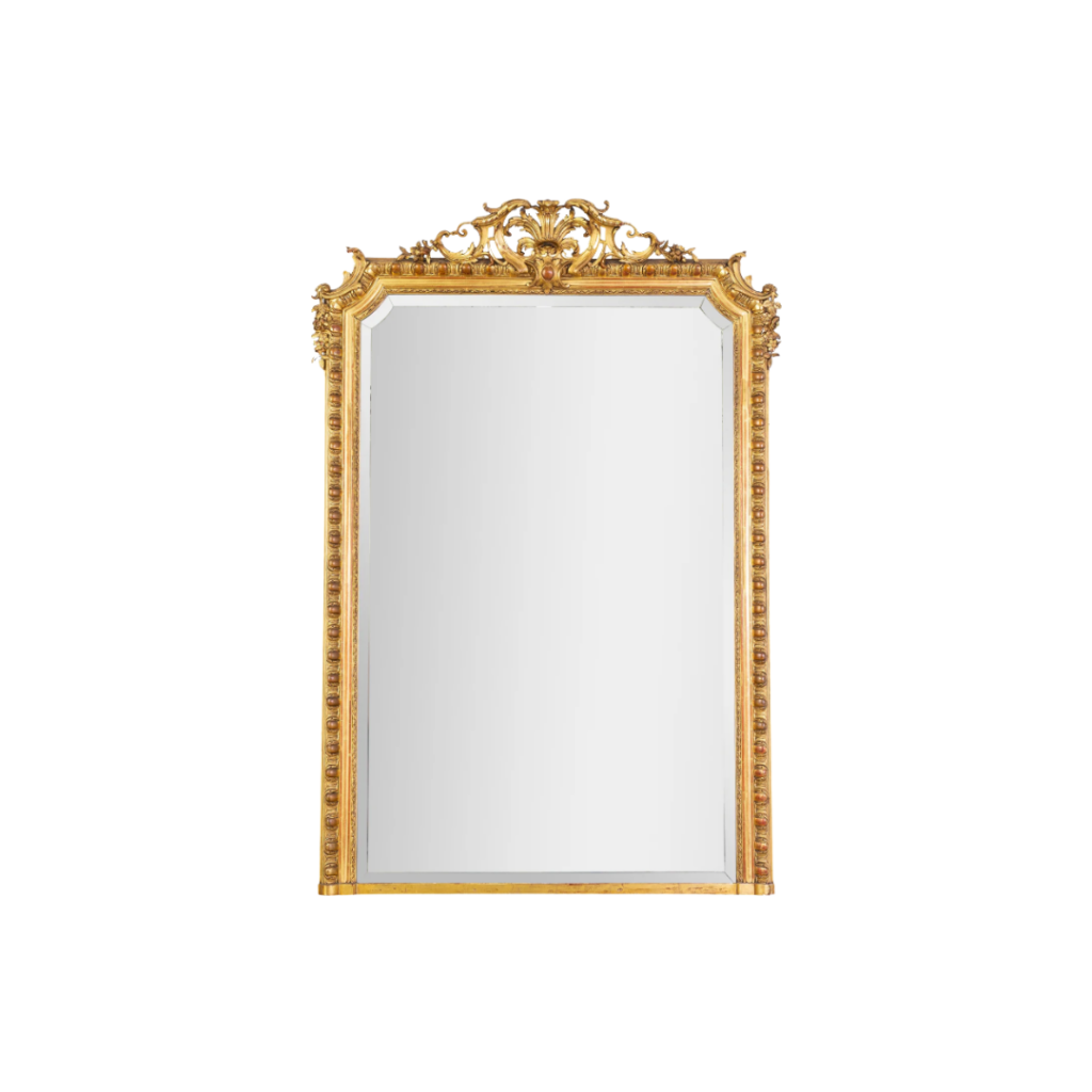 Antique Louis XVI-style gilt overmantel mirror with ornate egg-and-dart frame and foliate pediment, featuring original bevelled glass and rich gold leaf detailing.​